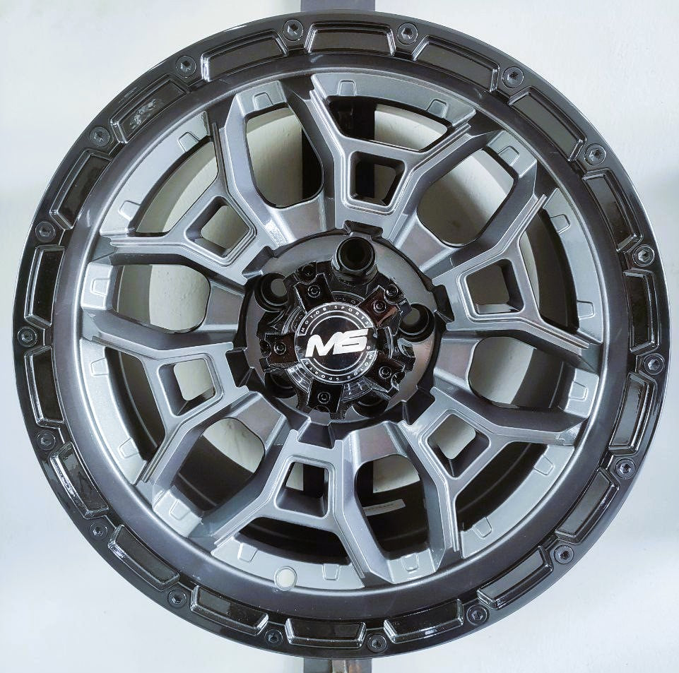 Juego de rines 15x9.0 6-114.3 ET -12 Grey Black Lip CB 66.1